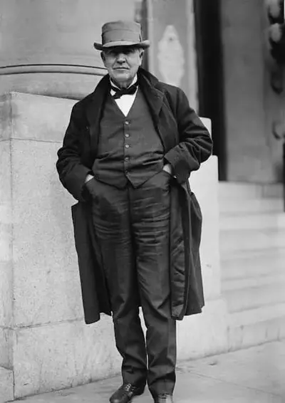 Thomas Edison wearing a suit and hat.