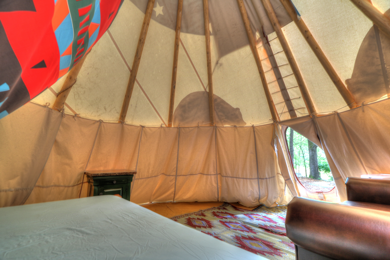 bed and couch in tipi