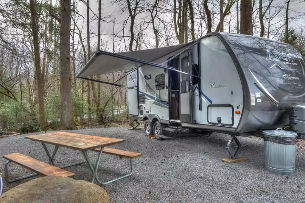 smoky mountain campground where rv is parked with picnic table