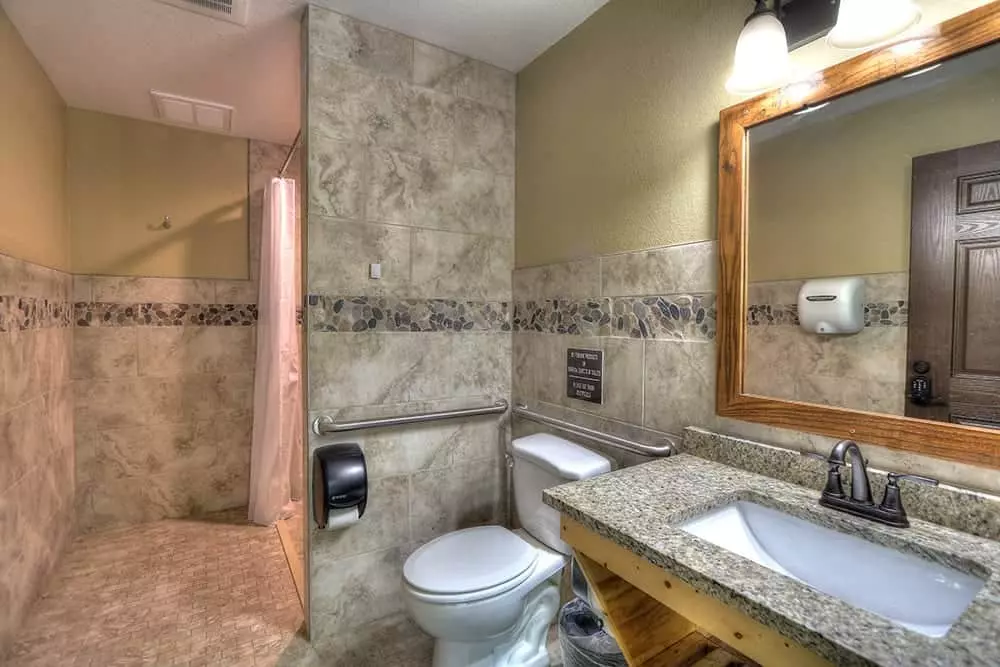 shower, toilet, and sink in the bath house