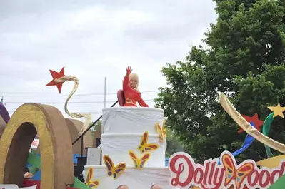 Photo of Dolly Parton at her annual parade in the Smoky Mountains.