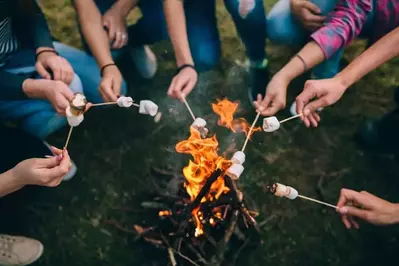 Group roasting marshmallows together