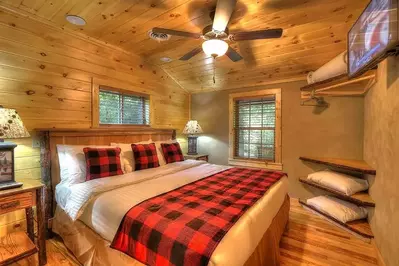 The relaxing bedroom in the Flint Rock Cabin at Greenbrier Campground in the Smoky Mountains.