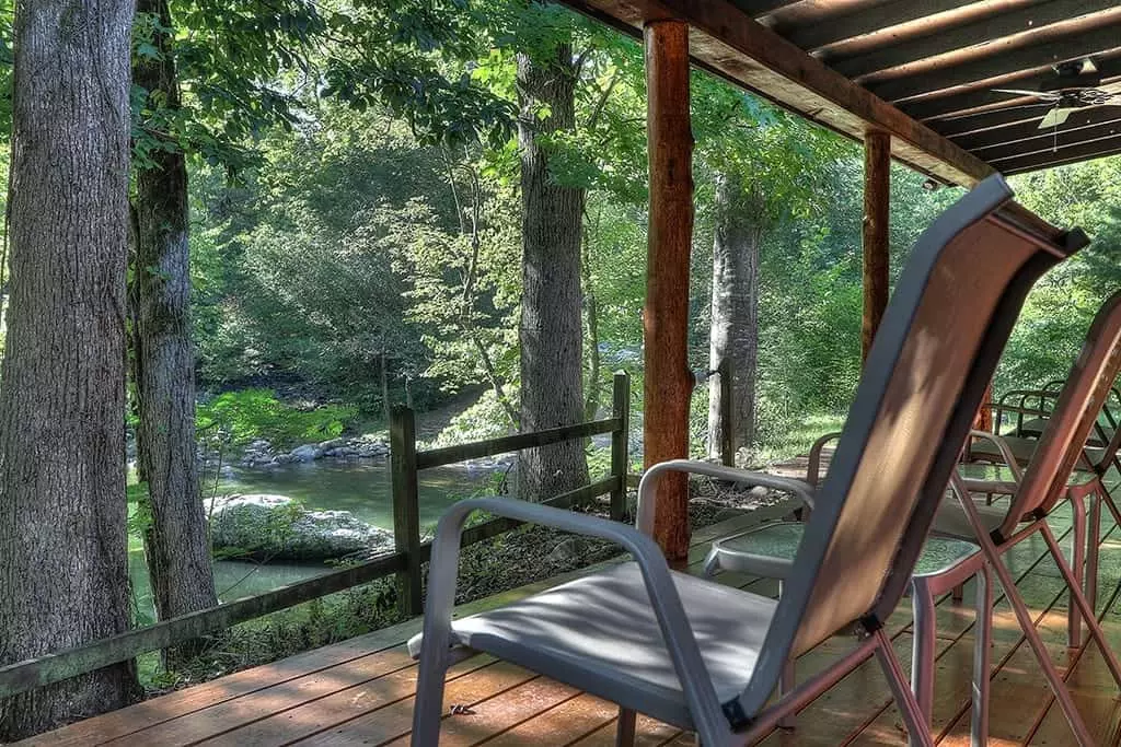Chairs on the deck of the Flint Rock Cabin overlooking the Little Pigeon River.