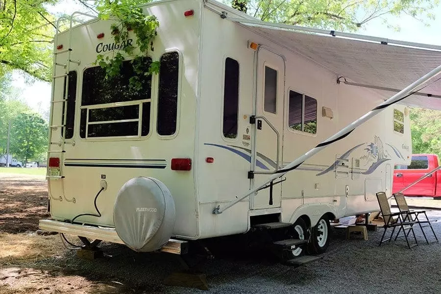 A big white RV at Greenbrier Campground in the Smoky Mountains.