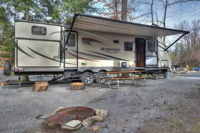 rv rental with firepit and picnic table at a smoky mountain campground