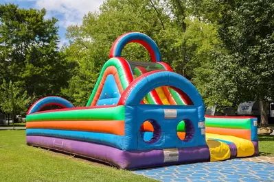 play in the bounce house while smokies camping with family